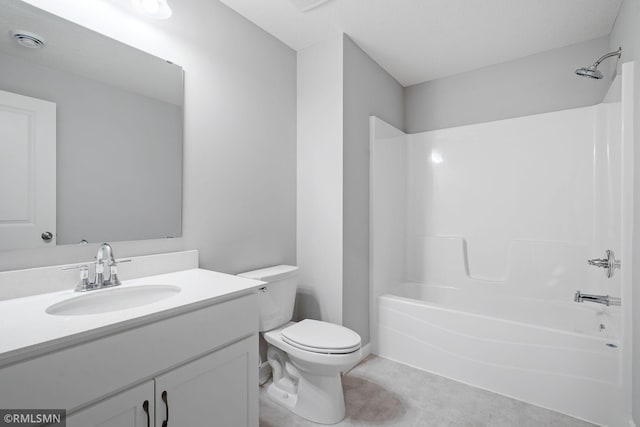 full bathroom with toilet, vanity, and shower / tub combination