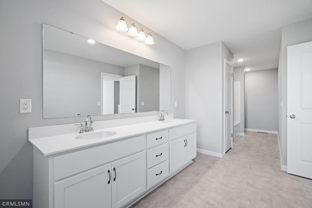 bathroom featuring a bathtub and vanity