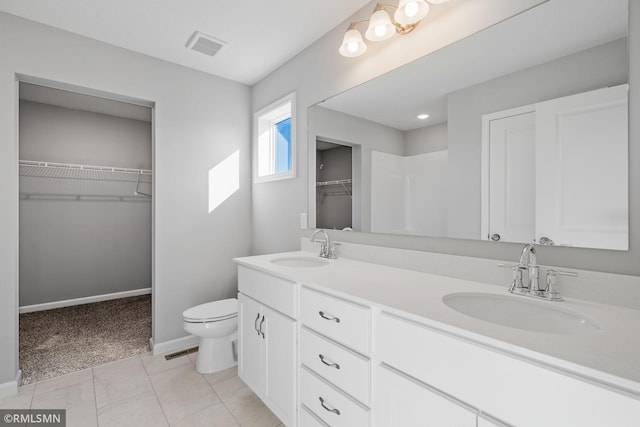 bathroom featuring toilet and vanity