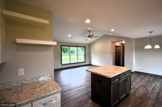 kitchen featuring white cabinetry, vaulted ceiling, decorative light fixtures, dark brown cabinets, and ceiling fan with notable chandelier