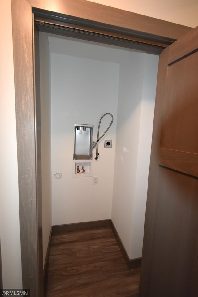 laundry area with hookup for an electric dryer, hookup for a washing machine, and dark hardwood / wood-style flooring