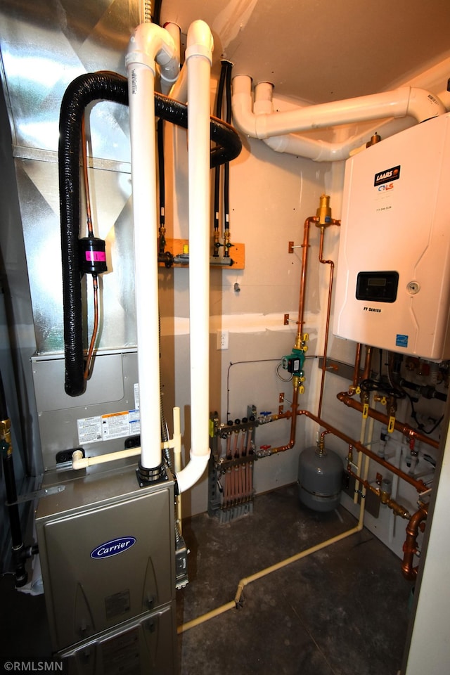 utility room featuring tankless water heater and heating unit