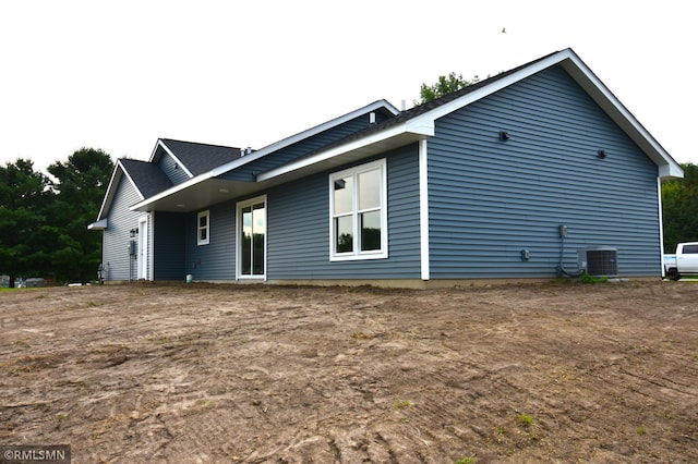 rear view of property with central air condition unit