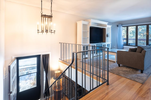 interior space with hardwood / wood-style flooring and a notable chandelier