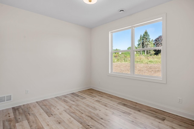 spare room with light hardwood / wood-style floors