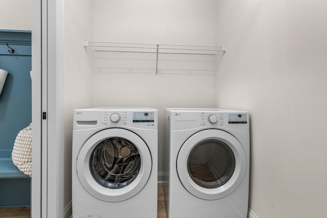 washroom featuring washer and dryer and hardwood / wood-style floors