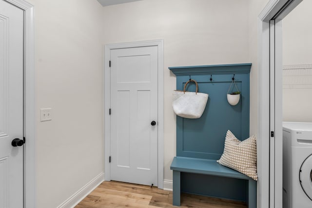 mudroom featuring light wood-type flooring and washer / dryer