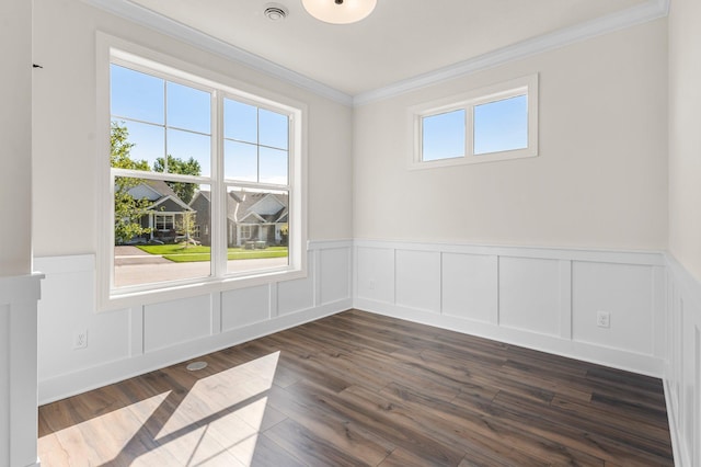 spare room with dark hardwood / wood-style floors and ornamental molding