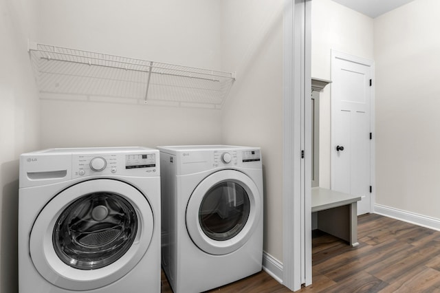 laundry room featuring dark hardwood / wood-style floors and washing machine and clothes dryer