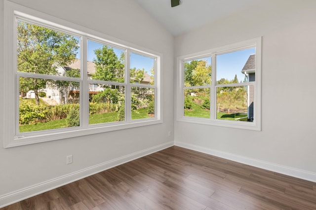 unfurnished sunroom featuring vaulted ceiling