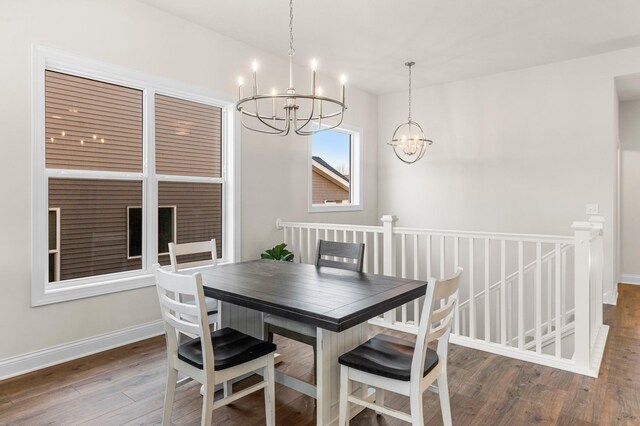 dining space with a chandelier and hardwood / wood-style floors