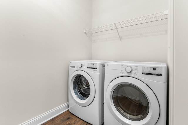 laundry area featuring dark hardwood / wood-style floors and independent washer and dryer