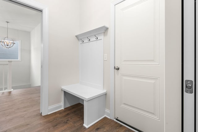 mudroom featuring hardwood / wood-style floors and an inviting chandelier