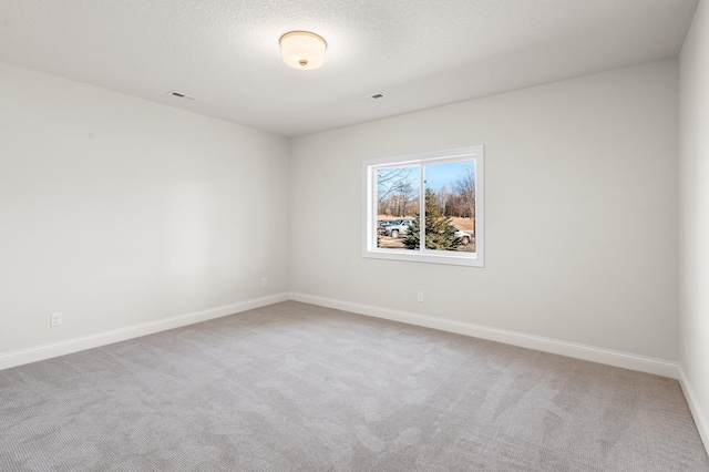 empty room featuring light colored carpet