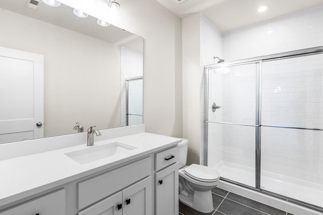 bathroom with toilet, walk in shower, tile patterned floors, and vanity