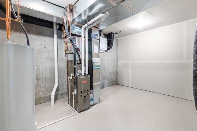 utility room with electric water heater and heating unit