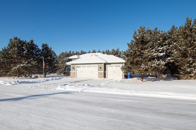 view of snow covered garage