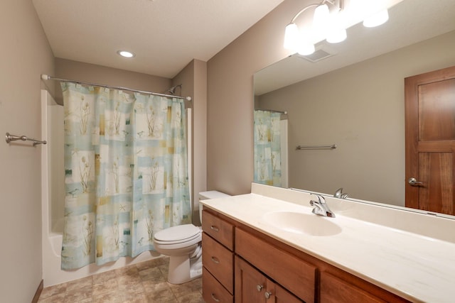 full bathroom featuring shower / bath combo, vanity, and toilet