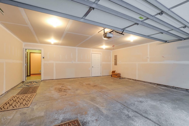 garage with electric panel and a garage door opener