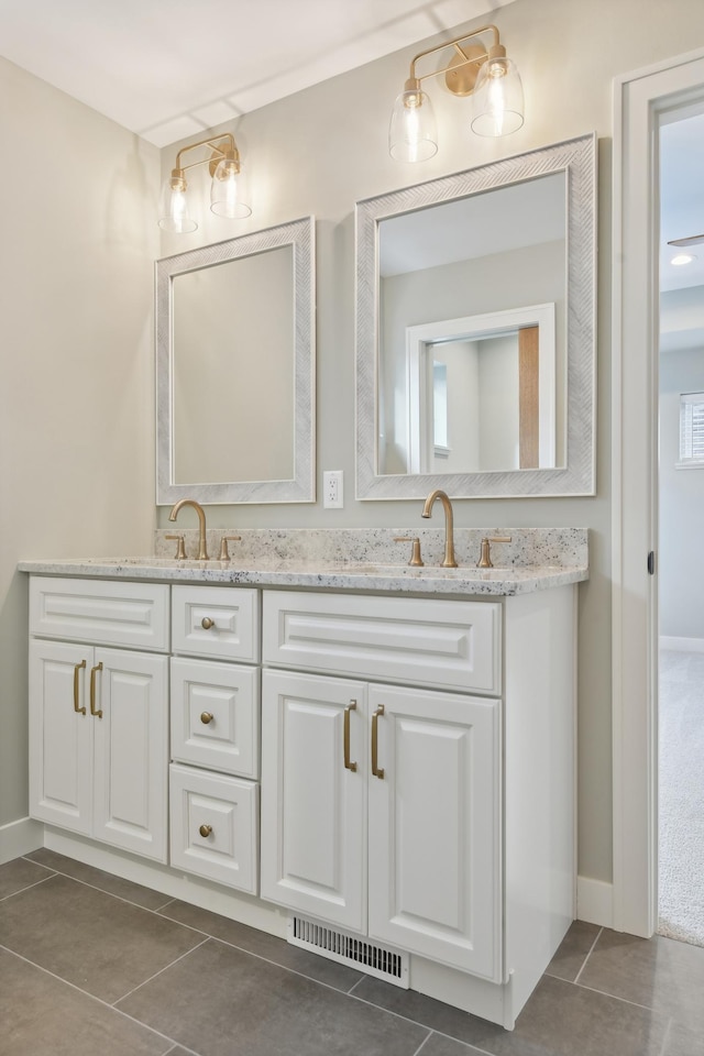 bathroom featuring tile patterned floors and vanity