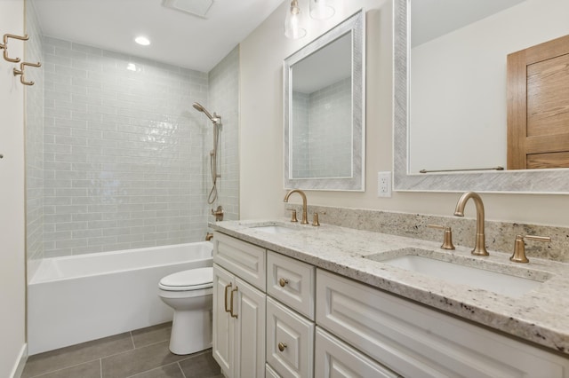 full bathroom with tile patterned floors, vanity, toilet, and tiled shower / bath