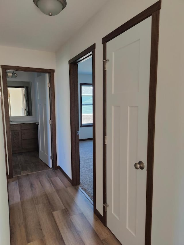 hall with light hardwood / wood-style floors