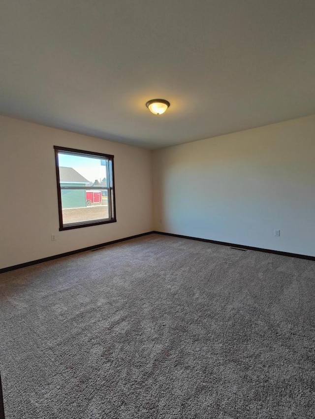 empty room with carpet flooring