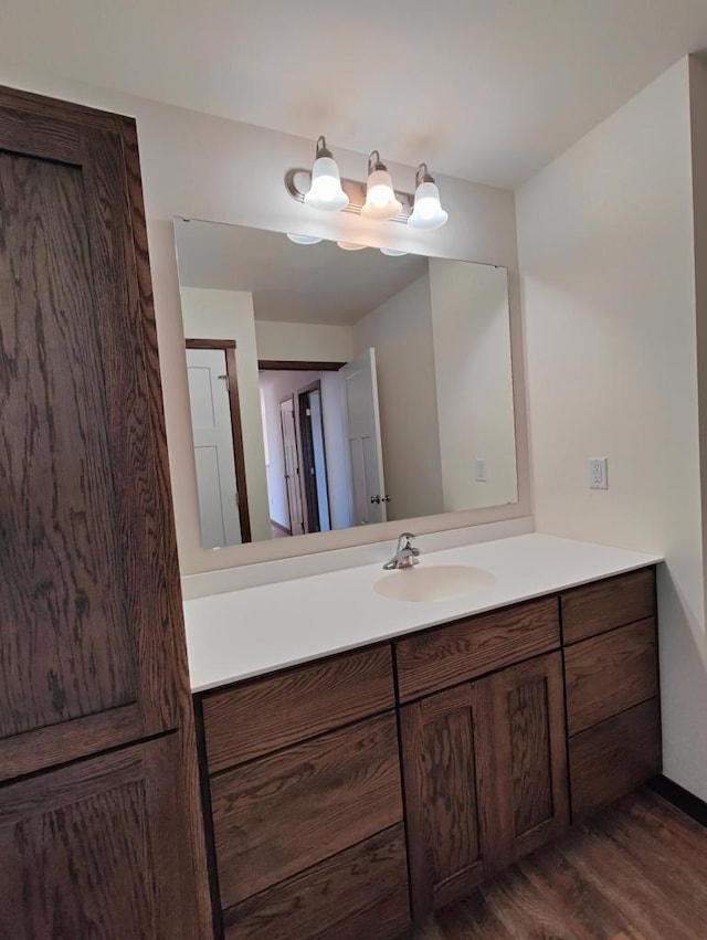 bathroom featuring vanity and hardwood / wood-style flooring