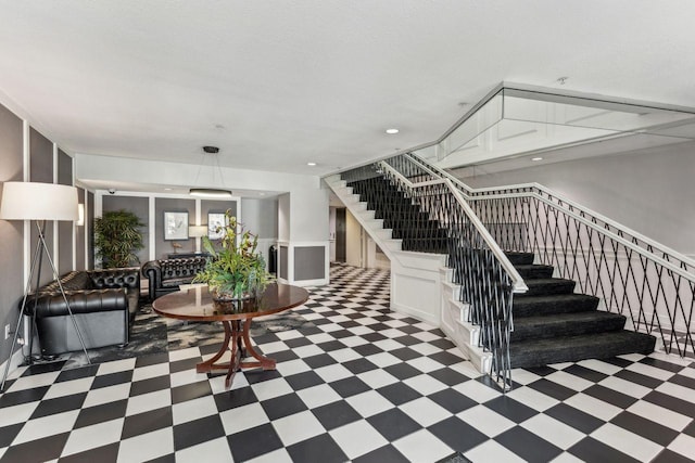 stairs with a textured ceiling