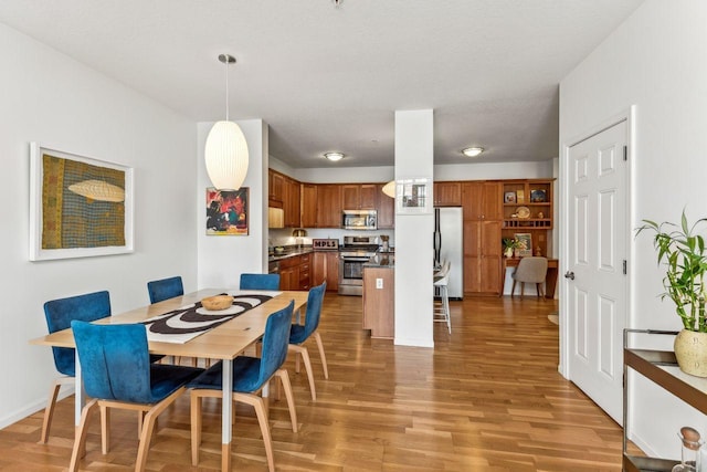 dining room with light hardwood / wood-style floors