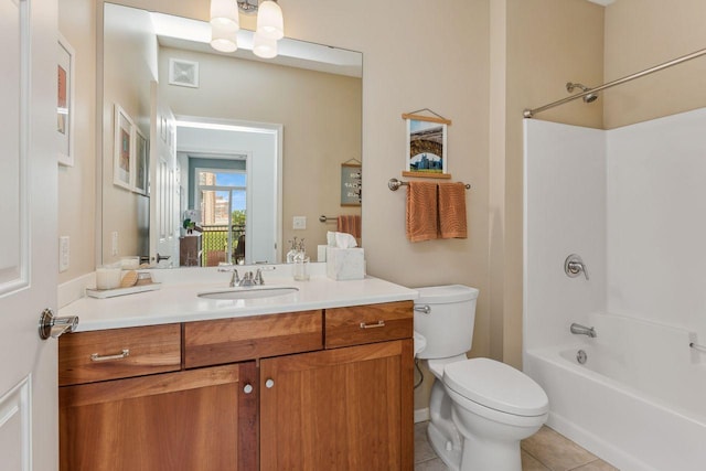 full bathroom with tile patterned flooring, vanity, bathing tub / shower combination, and toilet