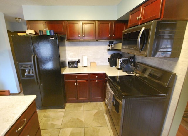 kitchen featuring appliances with stainless steel finishes, backsplash, and light tile patterned floors