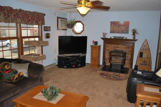 living room with carpet, a textured ceiling, baseboard heating, ceiling fan, and a wood stove