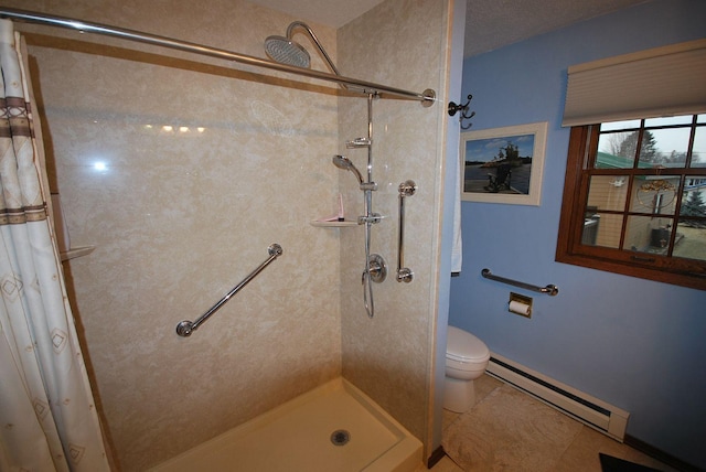 bathroom featuring tile patterned flooring, a shower with shower curtain, baseboard heating, and toilet