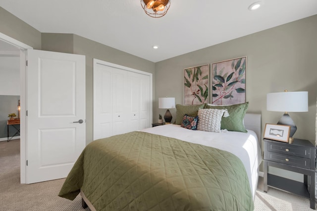 carpeted bedroom with a closet