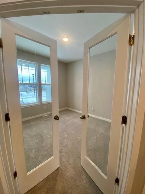 entryway with carpet flooring