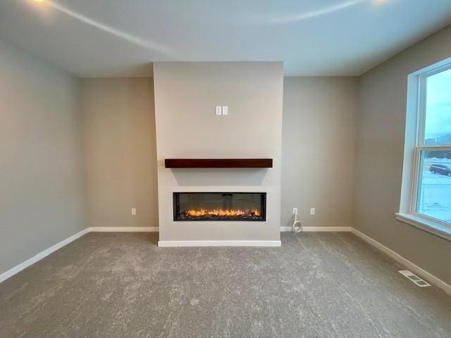 unfurnished living room with carpet floors