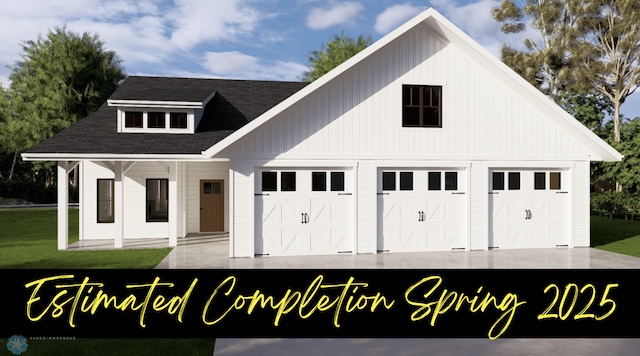 view of front facade featuring a garage, a front yard, and covered porch