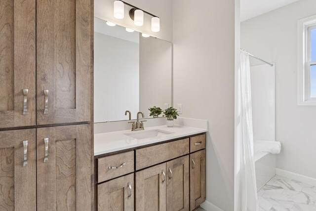 bathroom featuring vanity, a shower with curtain, baseboards, and marble finish floor