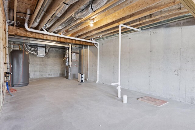 unfinished basement featuring heating unit