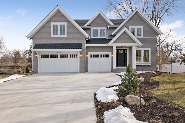 craftsman inspired home with a garage