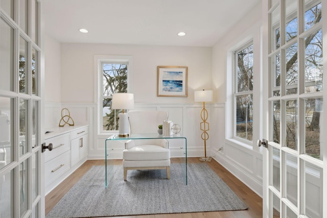 office space featuring light hardwood / wood-style flooring and french doors