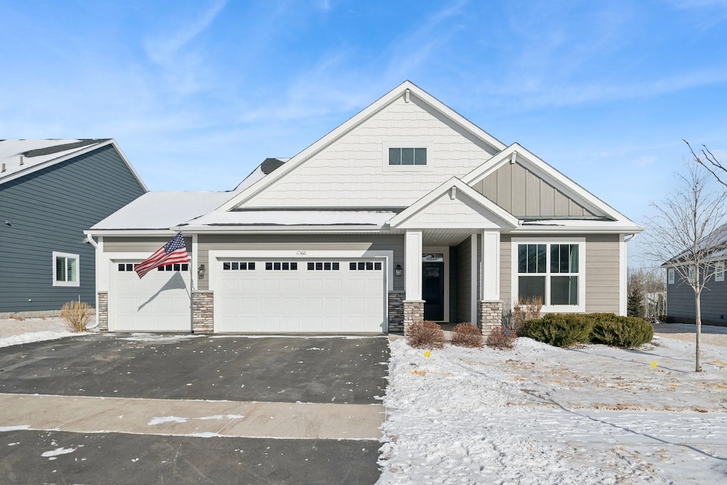 craftsman inspired home with a garage