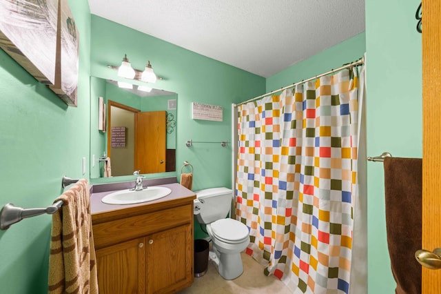 bathroom with vanity, a textured ceiling, toilet, and curtained shower