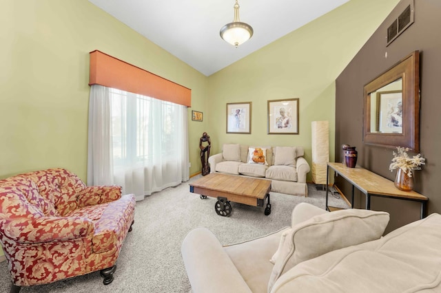 living room featuring carpet flooring and lofted ceiling