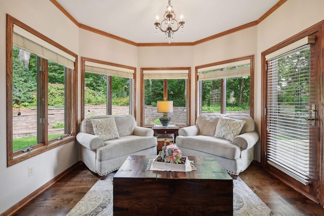 sunroom / solarium featuring plenty of natural light and an inviting chandelier