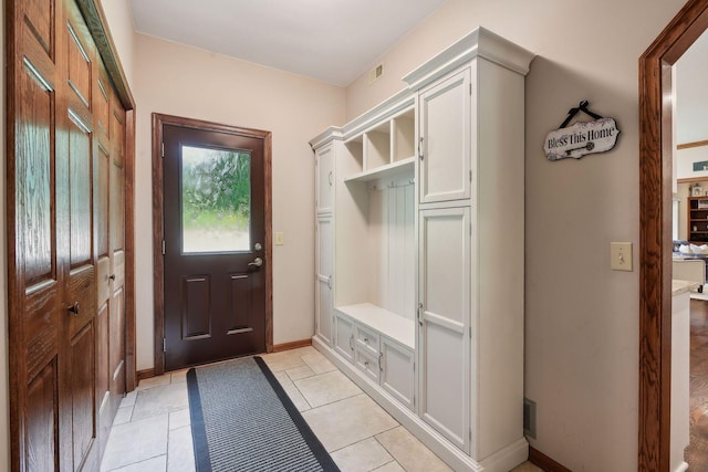 mudroom featuring light tile patterned flooring