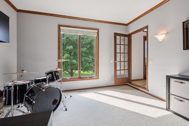 carpeted office space featuring french doors and ornamental molding