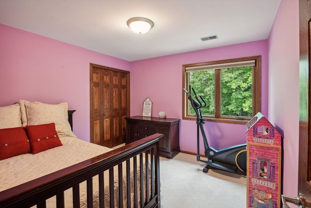 carpeted bedroom with a closet