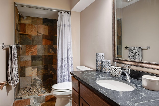 bathroom with a shower with shower curtain, vanity, and toilet